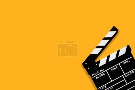 Photo for Movie clapperboard for shooting videos and movies on a orange background plenty of space for text - Royalty Free Image