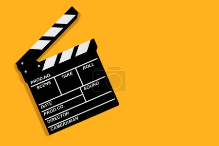 Téléchargez les photos : Film clapperboard pour filmer des vidéos et des films sur un fond orange - en image libre de droit