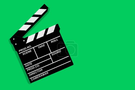 Movie clapperboard for shooting videos and movies on a green background copy space