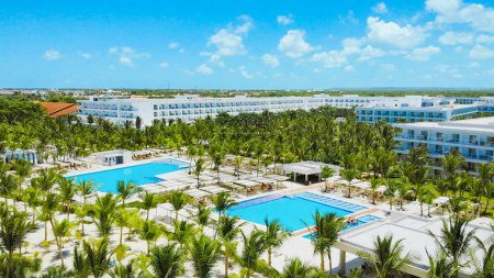 Photo for Pool area and bars in a tropical tourist resort, lux hotel in Caribbean, aerial view of luxury hotel with exotic poolside. Aerial view of luxury tropical resort.Drone view of resort with swimming pool - Royalty Free Image