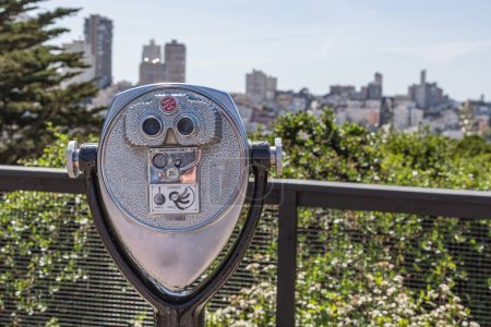 Photo for Coin operated binoculars with view of San Francisco. Closeup binocular on background viewpoint observe vision. Closeup of tourist coin operated binoculars at tourist places, blurred city on background - Royalty Free Image