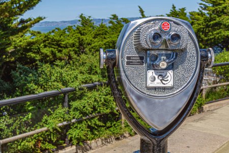 Photo for San Francisco, California, USA - 22 April, 2017: Coin operated binoculars overlooking Alcatraz Island, San Francisco City. Touristic binocular telescope look at the city with view mountains - Royalty Free Image