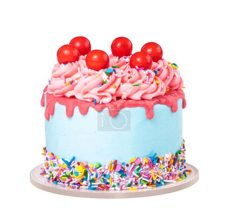 Birthday Drip Cake with red ganache, colorful sprinkles and cherry balls isolated on a pure white background. Fun and Trendy.