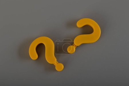 Question mark symbols isolated on a grey background