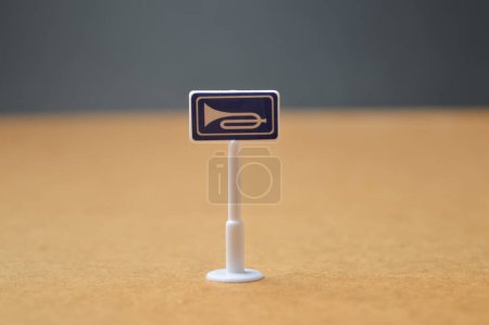 Photo for Blowing horn sign with blurred background - Royalty Free Image