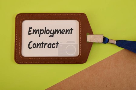 Foto de Name tag written with EMPLOYMENT CONTRACT. Signing contract for employment concept. - Imagen libre de derechos