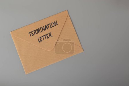 Foto de Brown envelope written with TERMINATION LETTER. Unfair dismissal concept. - Imagen libre de derechos