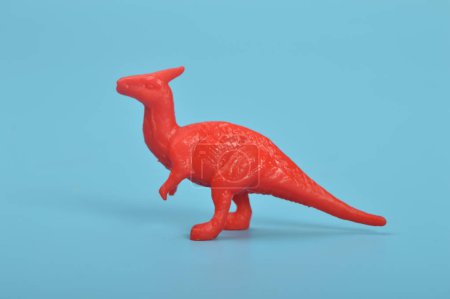 Foto de Parasaurolophus dinosaur toy model isolated on a blue background - Imagen libre de derechos