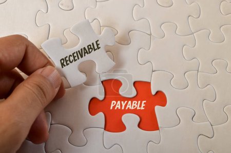 Photo for Jigsaw puzzle with text RECEIVABLE and PAYABLE. - Royalty Free Image