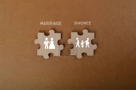 Photo for Jigsaw puzzle with MARRIAGE and DIVORCE symbol. Marriage and divorce are important social, cultural, and legal concepts that have significant implications for individuals, families, and society as a whole. - Royalty Free Image