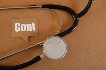 Photo for Stethoscope with text GOUT. Gout is a type of arthritis characterized by sudden and severe attacks of pain, redness, swelling, and tenderness in the joints - Royalty Free Image