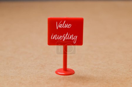 Photo for Road sign with text VALUE INVESTING. Growth value, increase value, value added or business growth concept. - Royalty Free Image