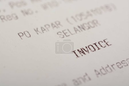 Photo for A close-up view of the word "INVOICE" on a sales receipt. - Royalty Free Image