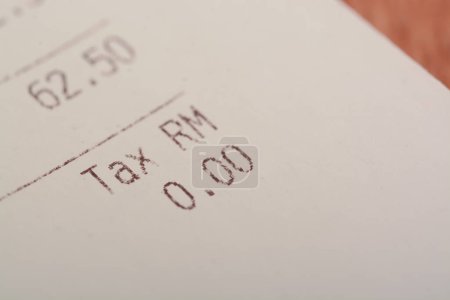 Photo for A close-up view of the word "TAX" on a sales receipt. - Royalty Free Image