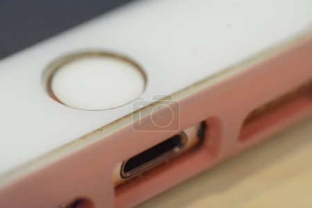 Klang, Malaysia: 3rd July 2023- Close up view of an iphone home button and charging port