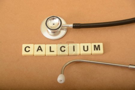 Photo for Stethoscope and alphabet letters with text CALCIUM. - Royalty Free Image