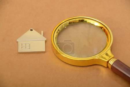 Photo for A magnifying glass and home. Homeowner examines every detail of their dream house, seeking the perfect place to call home - Royalty Free Image