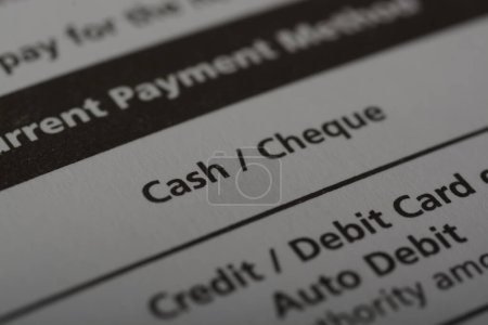 Photo for Close up view of the word CASH and CHEQUE. Cash and checks are two common forms of payment in financial transactions - Royalty Free Image