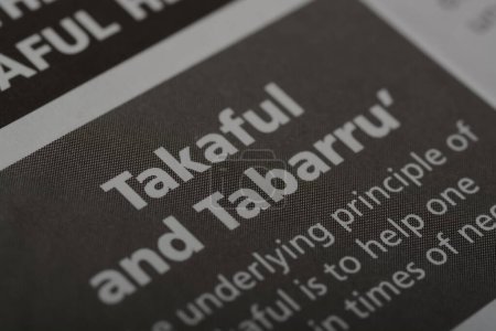 Photo for Close up view of the word TAKAFUL and TABARRU'.Takaful and Tabarru' are concepts related to Islamic insurance and risk-sharing practices - Royalty Free Image