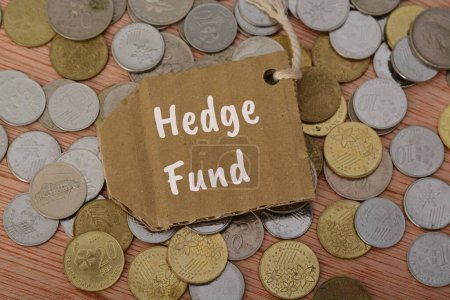 Photo for The text HEDGE FUND is a type of investment fund that pools capital from accredited individuals or institutional investors and employs to generate returns on that capital - Royalty Free Image
