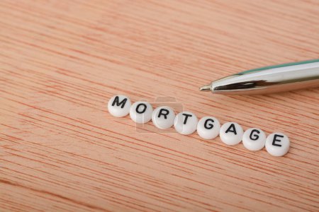 Photo for A mortgage is a financial agreement, typically a loan, used to purchase real estate, such as a home or property. - Royalty Free Image