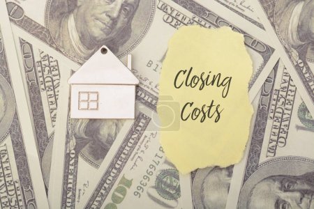 Photo for Closing costs are the various fees and expenses associated with the purchase or sale of real estate, typically incurred at the closing or settlement of a real estate transaction - Royalty Free Image