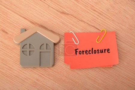 Photo for Foreclosure is a legal process in which a lender takes possession of a property and sells it to recover the outstanding balance on a mortgage loan when the homeowner fails to make mortgage payments, typically due to financial hardship - Royalty Free Image