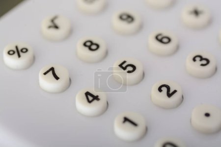 Photo for Close up view of white calculator numbers. - Royalty Free Image