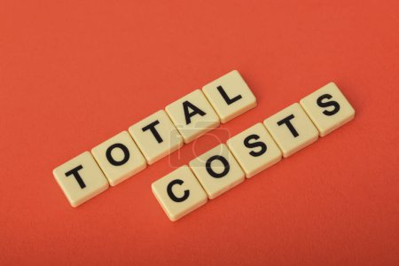 Photo for Total cost is the sum of expenses a company needs to manufacture a specific level of output. It's a total of fixed and variable costs, calculating which helps product managers evaluate their overall profit margin - Royalty Free Image