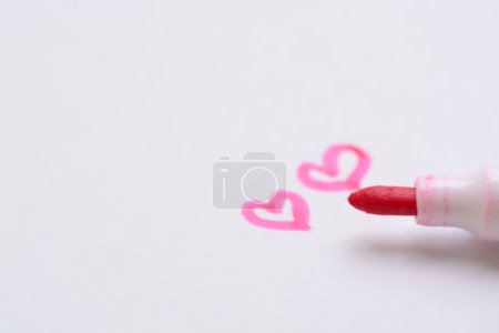 Photo for 'LOVE' written in pen embodies the essence of romantic affection, evoking heartfelt emotions and serving as a timeless expression of adoration. - Royalty Free Image