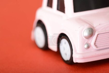 Photo for The close-up of a toy retro car highlights its miniature charm, offering a glimpse into the vintage design and craftsmanship that captures the essence of a simpler automotive era. - Royalty Free Image
