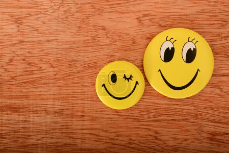 A cheerful yellow smiley face symbolizing positive thinking, concealing underlying negative emotions with a steadfast grin.