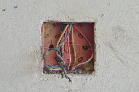 Photo for Wires, wire nuts, and cobwebs clutter the junction box, calling for reorganization and electrical fixes. - Royalty Free Image