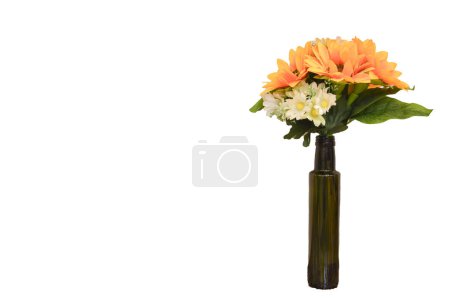 The decorative flowers in a vase add a touch of elegance and charm to any home decor arrangement.