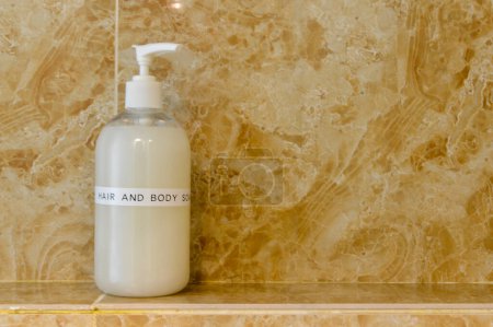 Photo for A hand soap liquid bottle is on the sink in the toilet. It ensures proper hygiene and cleanliness for all users. - Royalty Free Image