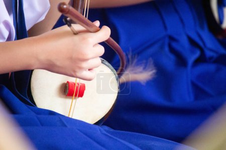 Photo for Close-up image of a woman playing a traditional musical instrument - Royalty Free Image
