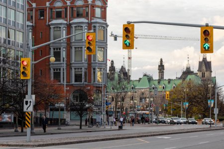 Photo for Ottawa, Canada - November 5, 2022: City view in downtown district near Parliament building. Cityscape with traffic lights and historical buildings. - Royalty Free Image