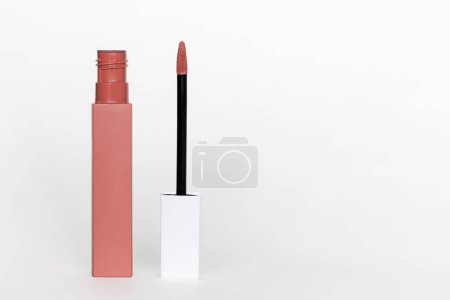 Photo for Open liquid lipstick standing on white background with copy space - Royalty Free Image