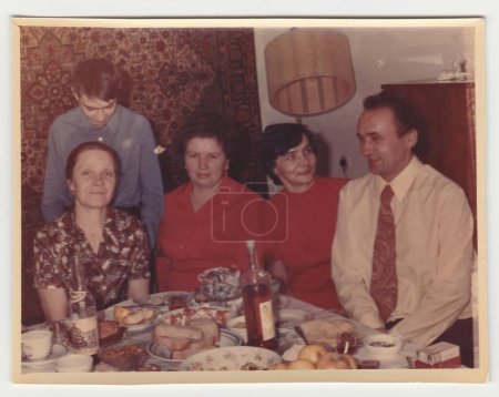 Photo for USSR - CIRCA 1970s: Vintage photo shows family during feast. - Royalty Free Image