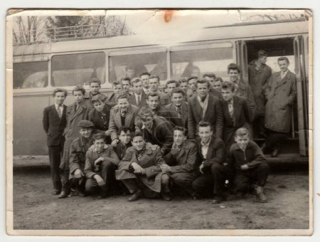 Photo for THE CZECHOSLOVAK SOCIALIST REPUBLIC - 1960s: Vintage photo shows young students pose in front of bus. Photo has error obtained during photo process. - Royalty Free Image