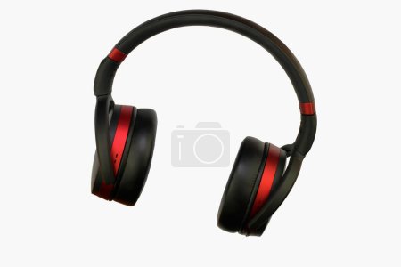 Photo for Wireless stereo headset. Black and red cordless headphones. Earphones isolated on white background with clipping path. Macro horizontal image, close-up - Royalty Free Image