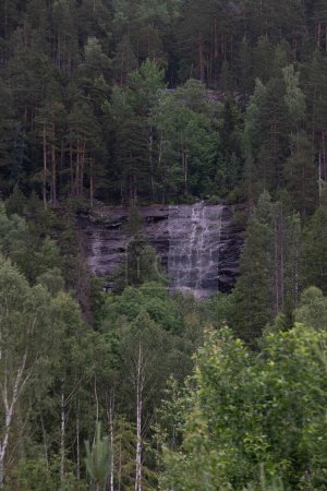 view of a Norwegian mountain secured with a net to prevent a landslide