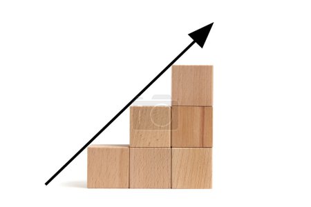 Téléchargez les photos : Wooden cubes are built form stair and arrows rising top.Concept growth and development - en image libre de droit