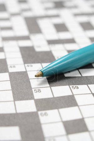 Photo for Ballpoint pen is lying crossword puzzle sheet - Royalty Free Image