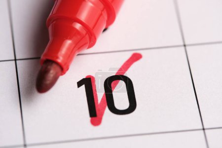 Photo for 10th day in the calendar is marked with a red marker - Royalty Free Image