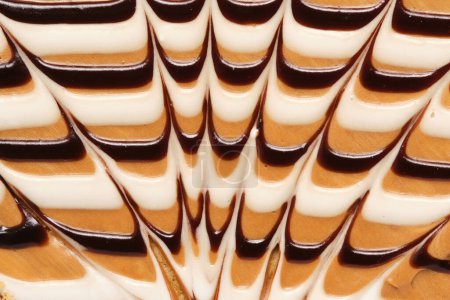 Abstraktes Zuckerguss Hintergrund Kondensmilch und Schokolade. Nahrungsmittelfoto