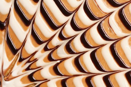 Abstraktes Zuckerguss Hintergrund Kondensmilch und Schokolade. Nahrungsmittelfoto
