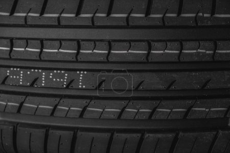 Car tire texture background. Black and white car tyre close up