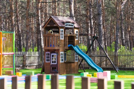 Children playground in the park in the summer in the open air