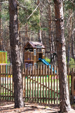 Children playground in the park in the summer in the open air